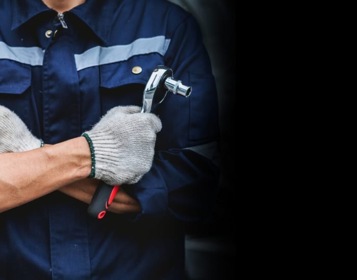 close-up of the mechanic’s hand with a wrench .Mechanic working close-up of the mechanic's hand with a wrench .Mechanic working